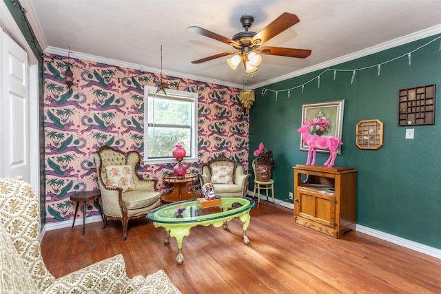 216 E Tennie St, Gainesville, TX 76240 - sitting room with crown molding, ceiling fan, baseboards, wood finished floors, and wallpapered walls