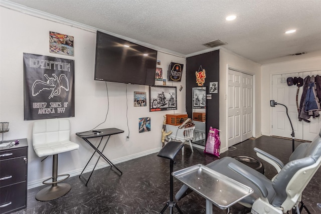 216 E Tennie St, Gainesville, TX 76240 - rec room with baseboards, a textured ceiling, tile patterned floors, recessed lighting, and crown molding