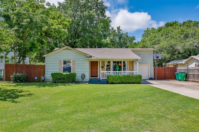 216 E Tennie St, Gainesville, TX 76240 - tri-level home with covered porch, driveway, roof with shingles, and an attached garage