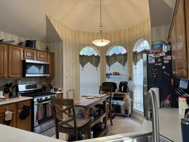 600 Black Rock Ct, Irving, TX 75063 - bedroom featuring crown molding, light carpet, a tiled fireplace, and ceiling fan