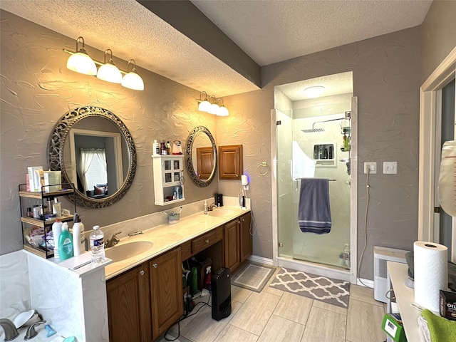 600 Black Rock Ct, Irving, TX 75063 - bathroom with a textured ceiling, a textured wall, a shower stall, double vanity, and wood finish floors