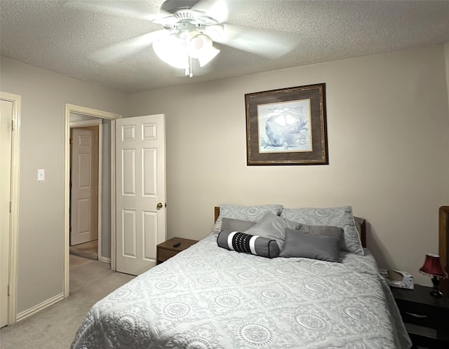 600 Black Rock Ct, Irving, TX 75063 - bedroom featuring light colored carpet, a textured ceiling, and ceiling fan
