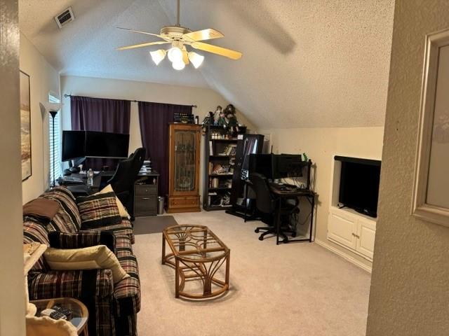 600 Black Rock Ct, Irving, TX 75063 - office with a ceiling fan, lofted ceiling, carpet, and a textured ceiling
