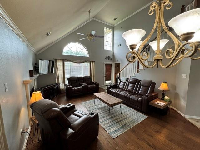 600 Black Rock Ct, Irving, TX 75063 - living area featuring wood finished floors, ceiling fan, stairs, high vaulted ceiling, and ornamental molding