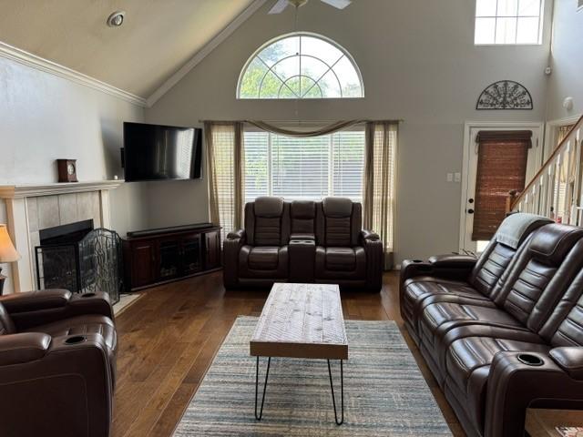 600 Black Rock Ct, Irving, TX 75063 - living area featuring a chandelier, stairs, dark wood-type flooring, high vaulted ceiling, and baseboards