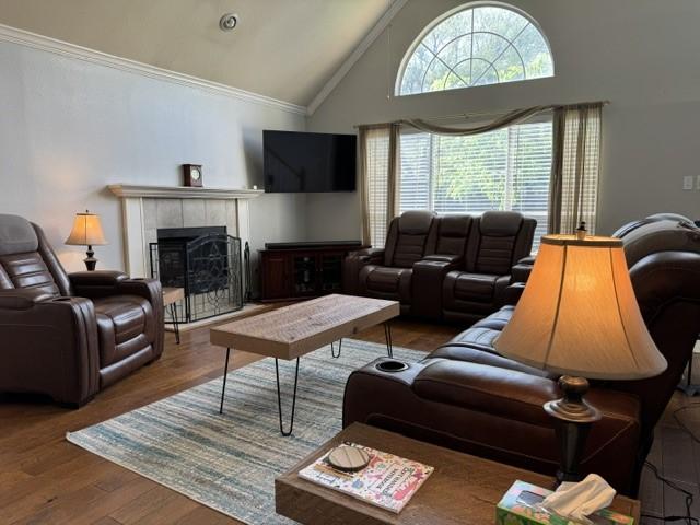 600 Black Rock Ct, Irving, TX 75063 - living area with crown molding, a chandelier, wood finished floors, a ceiling fan, and high vaulted ceiling