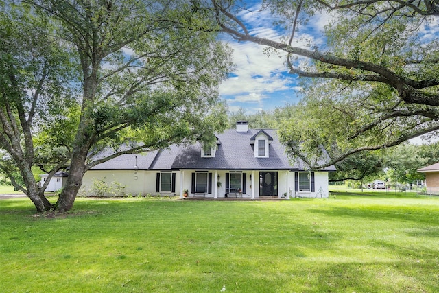 519 S Pearl St, Kemp, TX 75143 - new england style home featuring covered porch, a front lawn, and a chimney