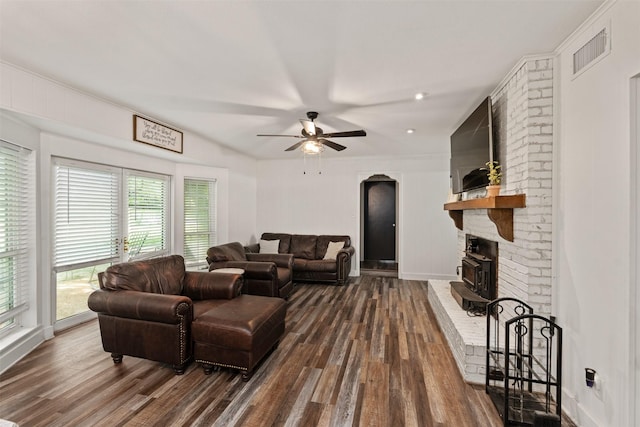 519 S Pearl St, Kemp, TX 75143 - living area with dark wood-style floors, a ceiling fan, and a brick fireplace
