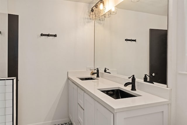 519 S Pearl St, Kemp, TX 75143 - bathroom featuring double vanity and baseboards