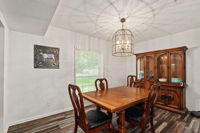 519 S Pearl St, Kemp, TX 75143 - dining space with dark wood finished floors, a chandelier, and baseboards