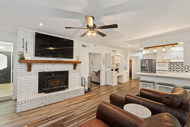 519 S Pearl St, Kemp, TX 75143 - living room featuring a ceiling fan, wood finished floors, and baseboards
