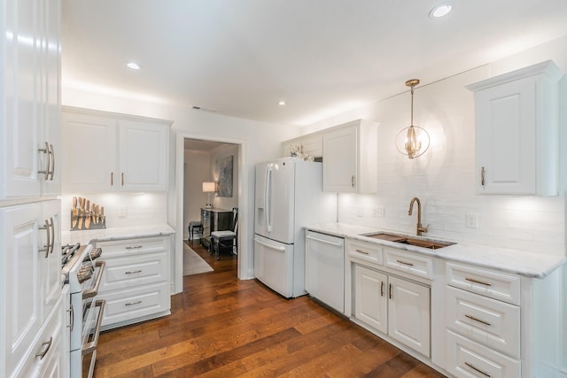 1233 Stegall Rd, Keller, TX 76248 - kitchen featuring white appliances, a sink, tasteful backsplash, white cabinets, and dark wood-style floors