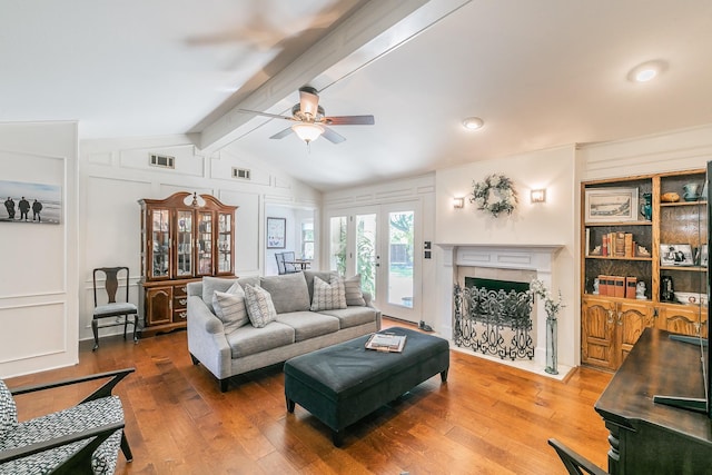 1233 Stegall Rd, Keller, TX 76248 - living room with a ceiling fan, hardwood / wood-style flooring, a premium fireplace, and a decorative wall