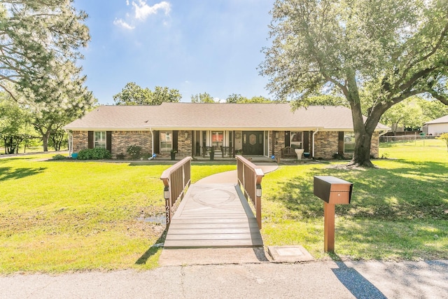 1233 Stegall Rd, Keller, TX 76248 - ranch-style home with a front yard, a porch, and brick siding