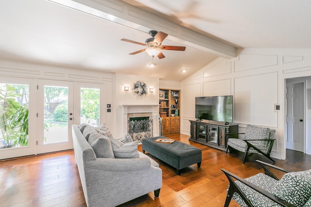 1233 Stegall Rd, Keller, TX 76248 - living area featuring hardwood / wood-style flooring, a ceiling fan, a fireplace, built in features, and a decorative wall