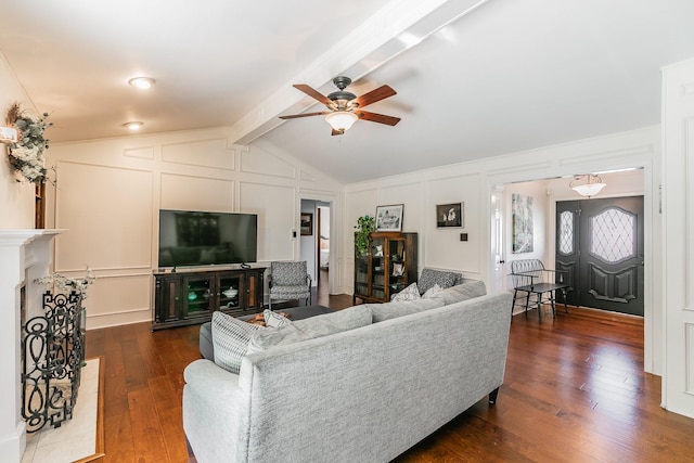 1233 Stegall Rd, Keller, TX 76248 - living room featuring a decorative wall, a ceiling fan, dark wood-style floors, and a fireplace with raised hearth