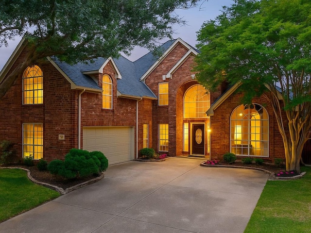 1308 Crown Point Rd, Mckinney, TX 75072 - traditional home featuring driveway, brick siding, a garage, and a shingled roof