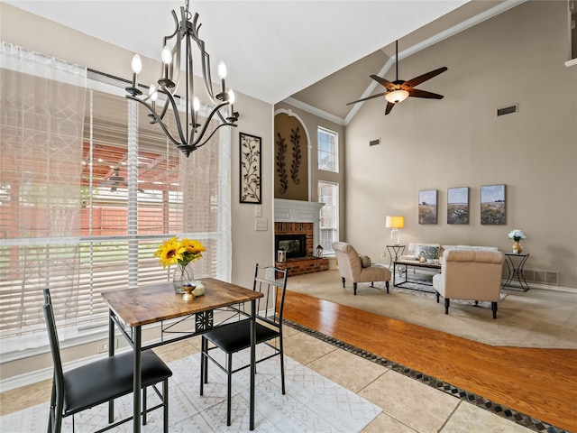 1308 Crown Point Rd, Mckinney, TX 75072 - dining space with light tile patterned floors, ceiling fan, high vaulted ceiling, baseboards, and ornamental molding