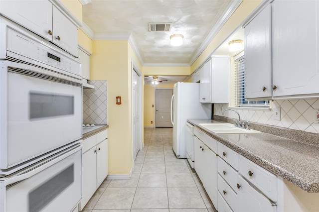 403 E Alexander Ln, Euless, TX 76040 - kitchen featuring a sink, tasteful backsplash, crown molding, and white cabinetry