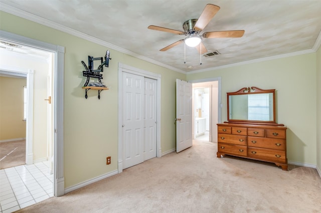 403 E Alexander Ln, Euless, TX 76040 - bedroom with light carpet, a closet, crown molding, baseboards, and ceiling fan