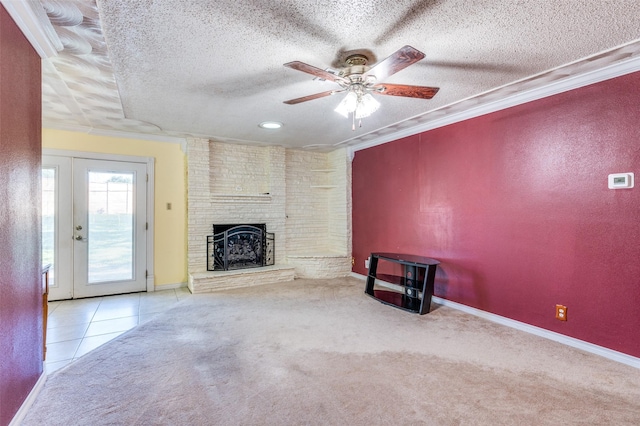 403 E Alexander Ln, Euless, TX 76040 - unfurnished living room with a ceiling fan, a textured ceiling, ornamental molding, a brick fireplace, and carpet flooring