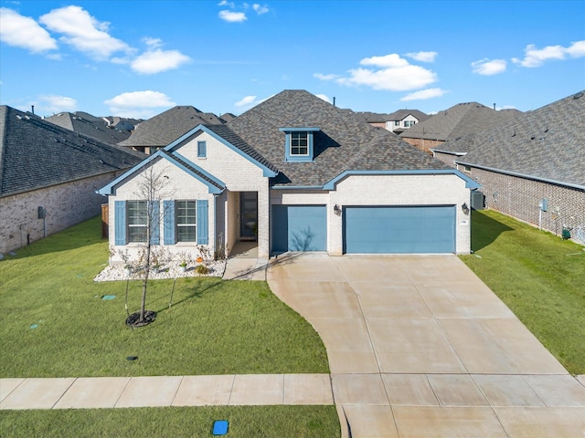 1708 Jamestown Dr, Forney, TX 75126 - view of front of property featuring a garage, concrete driveway, a shingled roof, a front lawn, and brick siding
