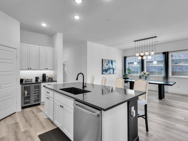 1708 Jamestown Dr, Forney, TX 75126 - kitchen featuring a sink, stainless steel dishwasher, dark countertops, recessed lighting, and white cabinetry