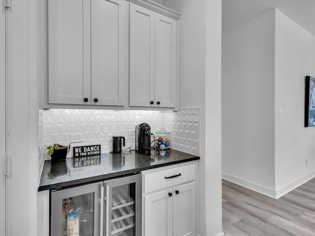 1708 Jamestown Dr, Forney, TX 75126 - indoor dry bar with tasteful backsplash, light wood-style flooring, wine cooler, and baseboards