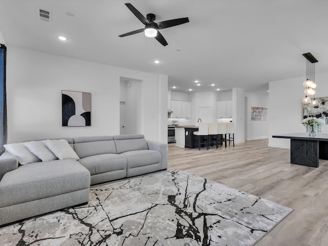 1708 Jamestown Dr, Forney, TX 75126 - living area featuring a ceiling fan, light wood-type flooring, recessed lighting, and baseboards