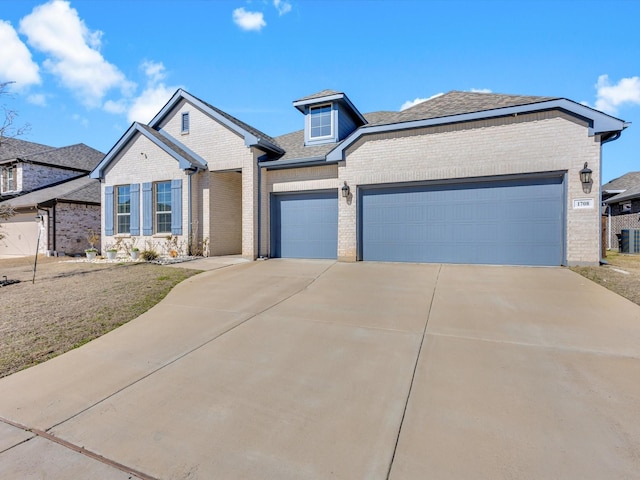 1708 Jamestown Dr, Forney, TX 75126 - traditional home featuring brick siding, an attached garage, driveway, and a shingled roof