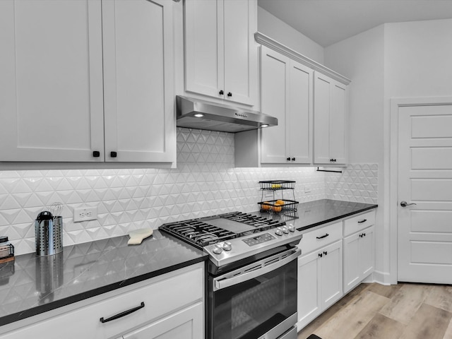 1708 Jamestown Dr, Forney, TX 75126 - kitchen featuring stainless steel gas range, under cabinet range hood, light wood-type flooring, white cabinetry, and decorative backsplash
