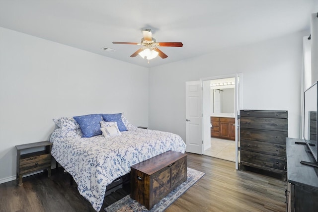 544 Baverton Ln, Fort Worth, TX 76052 - bedroom with wood finished floors, ceiling fan, baseboards, and ensuite bath