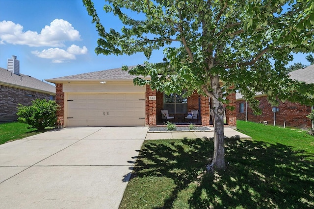 544 Baverton Ln, Fort Worth, TX 76052 - obstructed view of property with brick siding, a garage, a front yard, and concrete driveway