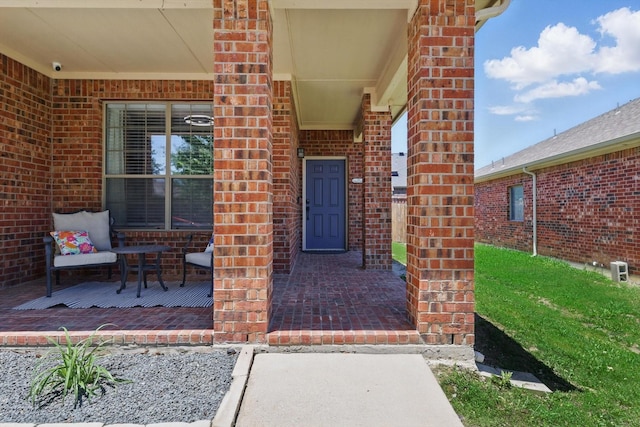 544 Baverton Ln, Fort Worth, TX 76052 - entrance to property featuring brick siding, a porch, and a security system