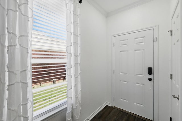 544 Baverton Ln, Fort Worth, TX 76052 - doorway featuring ornamental molding, dark wood finished floors, and baseboards