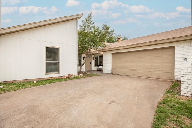 4702 Pamela Dr, Abilene, TX 79606 - view of front of house featuring brick siding, a garage, and driveway