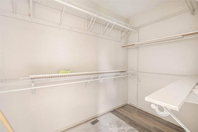 4702 Pamela Dr, Abilene, TX 79606 - walk in closet featuring wood finished floors