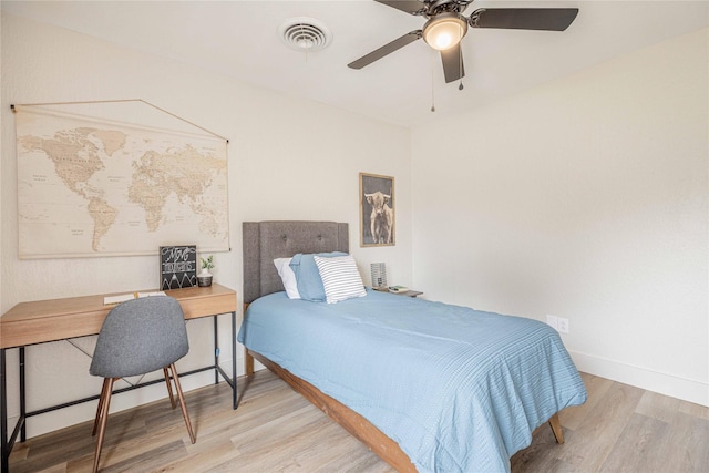 4702 Pamela Dr, Abilene, TX 79606 - bedroom with wood finished floors, baseboards, an office area, and ceiling fan