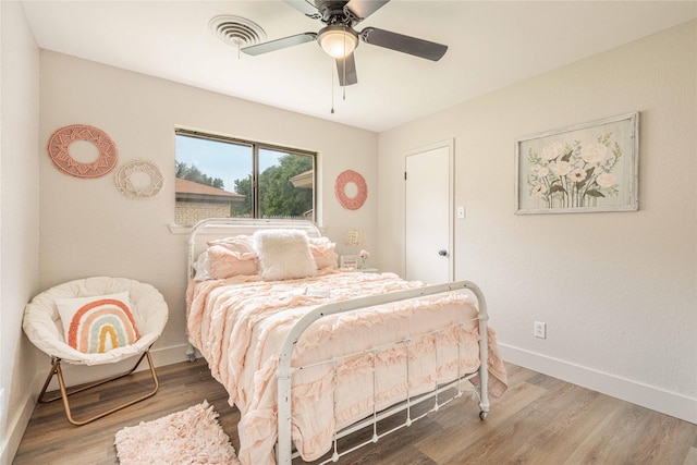 4702 Pamela Dr, Abilene, TX 79606 - bedroom with wood finished floors, baseboards, and ceiling fan