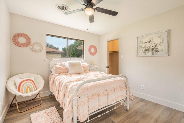 4702 Pamela Dr, Abilene, TX 79606 - bedroom with wood finished floors, baseboards, and a ceiling fan