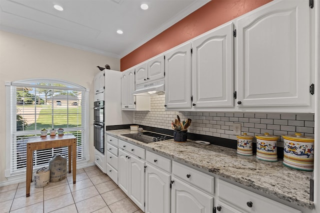711 Aqua Vista Dr, Granbury, TX 76049 - kitchen with black appliances, under cabinet range hood, white cabinetry, backsplash, and light tile patterned floors