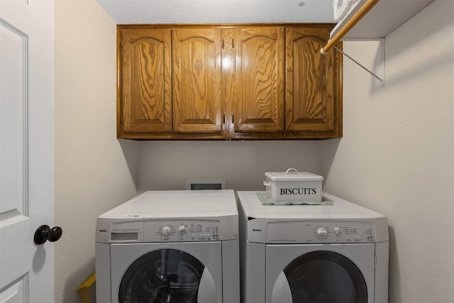 711 Aqua Vista Dr, Granbury, TX 76049 - laundry room featuring washer and clothes dryer and cabinet space
