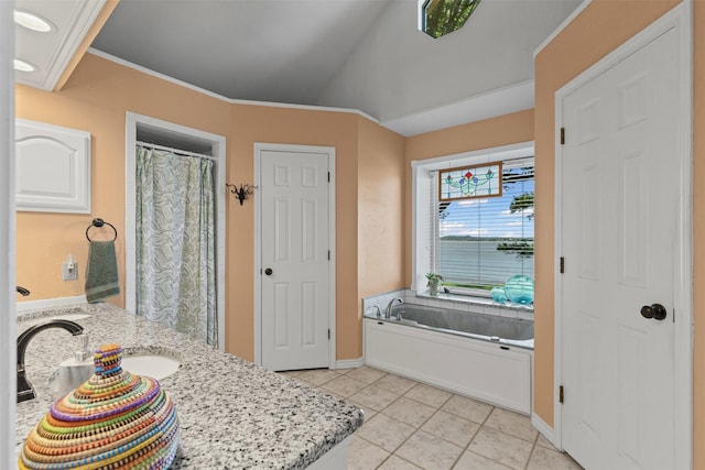 711 Aqua Vista Dr, Granbury, TX 76049 - full bath featuring tile patterned flooring, a garden tub, baseboards, vanity, and vaulted ceiling