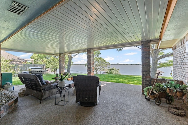 711 Aqua Vista Dr, Granbury, TX 76049 - view of patio with a water view