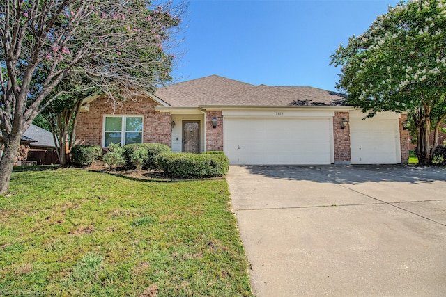 3809 San Lorenzo Dr, Denton, TX 76210 - single story home featuring brick siding, an attached garage, concrete driveway, a front yard, and roof with shingles