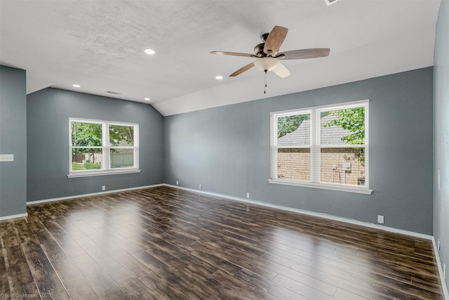 3809 San Lorenzo Dr, Denton, TX 76210 - empty room featuring healthy amount of natural light, dark wood-type flooring, ceiling fan, lofted ceiling, and baseboards