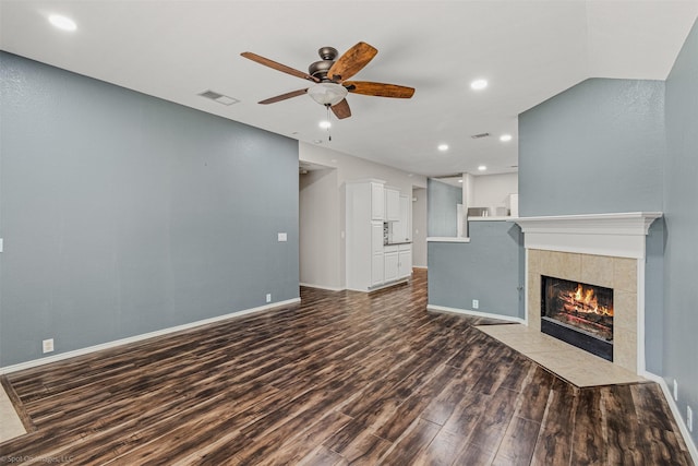 3809 San Lorenzo Dr, Denton, TX 76210 - unfurnished living room with dark wood finished floors, a ceiling fan, a tiled fireplace, recessed lighting, and baseboards