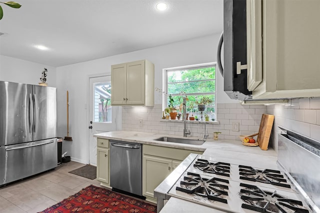 11202 Myrtice Dr, Dallas, TX 75228 - kitchen with stainless steel appliances, plenty of natural light, tasteful backsplash, a sink, and recessed lighting