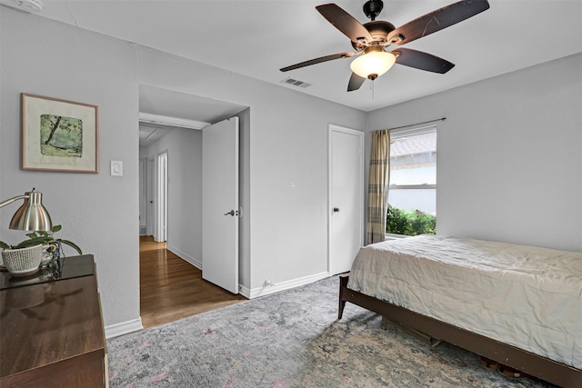 11202 Myrtice Dr, Dallas, TX 75228 - bedroom with baseboards, ceiling fan, and wood finished floors