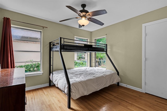 11202 Myrtice Dr, Dallas, TX 75228 - bedroom with wood finished floors, baseboards, and a ceiling fan
